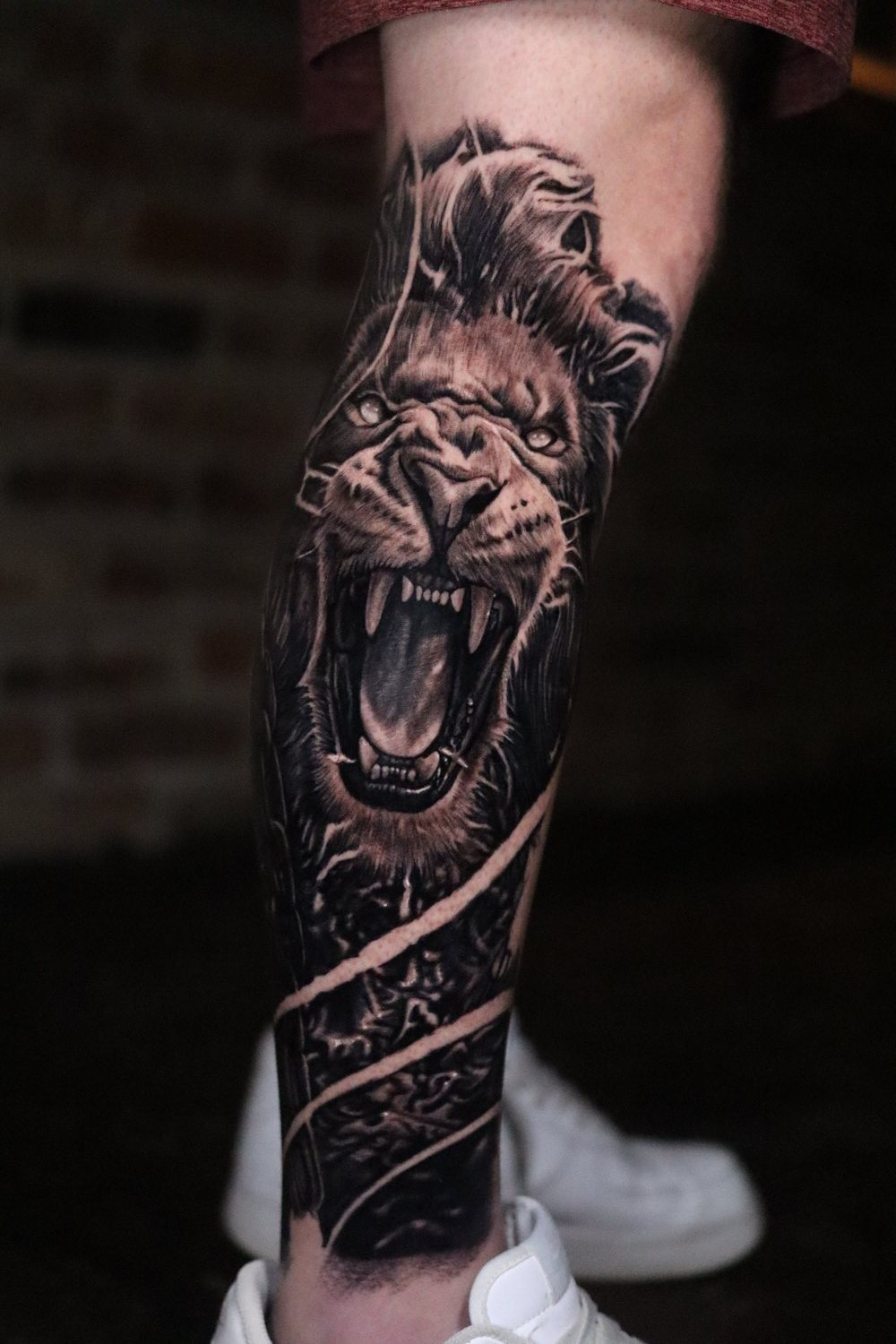 Black and grey lion sleeve tattooed at Philly Joe Tattoo Studio