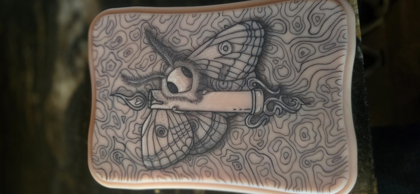 Moth and dagger blackwork thigh tattoo