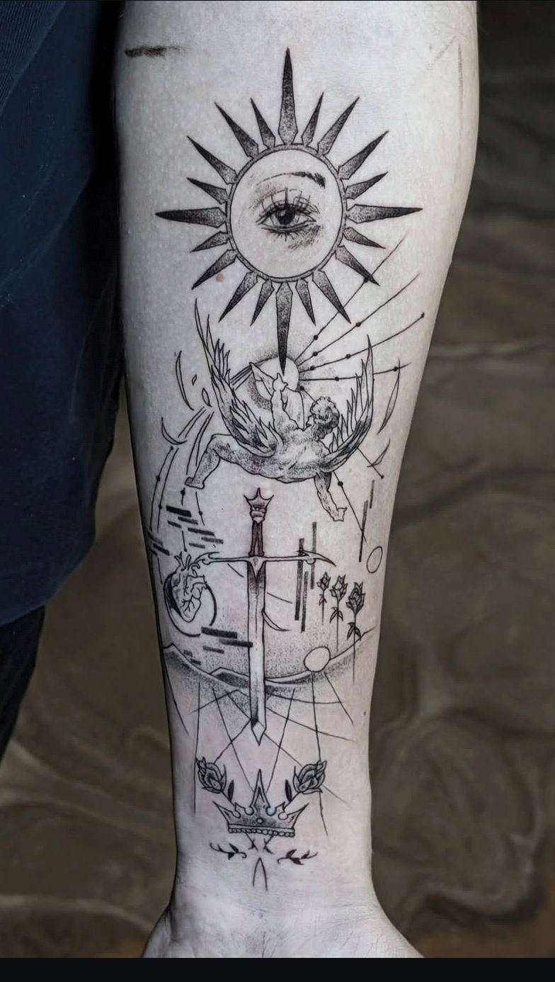 Fine-line sun, eye and sword leg tattoo